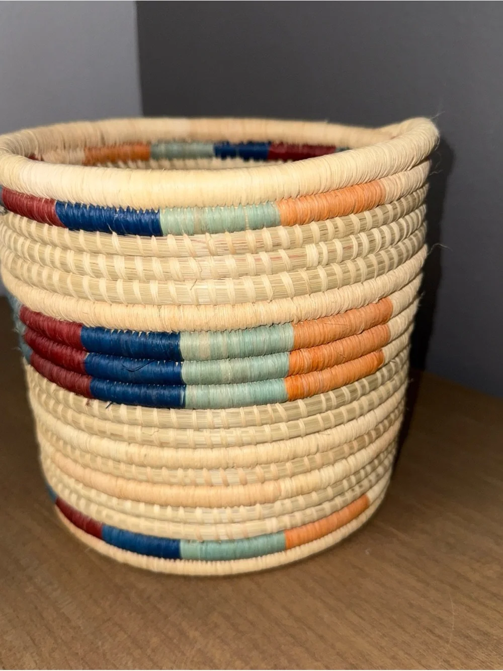 Handwoven Natural Basket with Red and Blue Accents